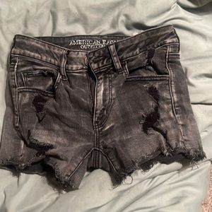 black ripped jean shorts